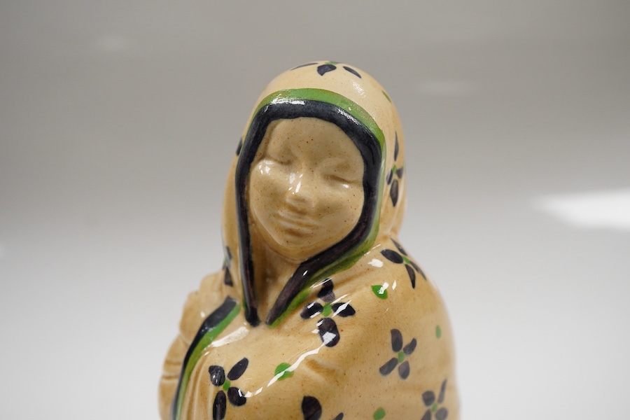 An Ashtead pottery figure of a kneeling ‘eastern lady’, stamped to the base, 15cm high